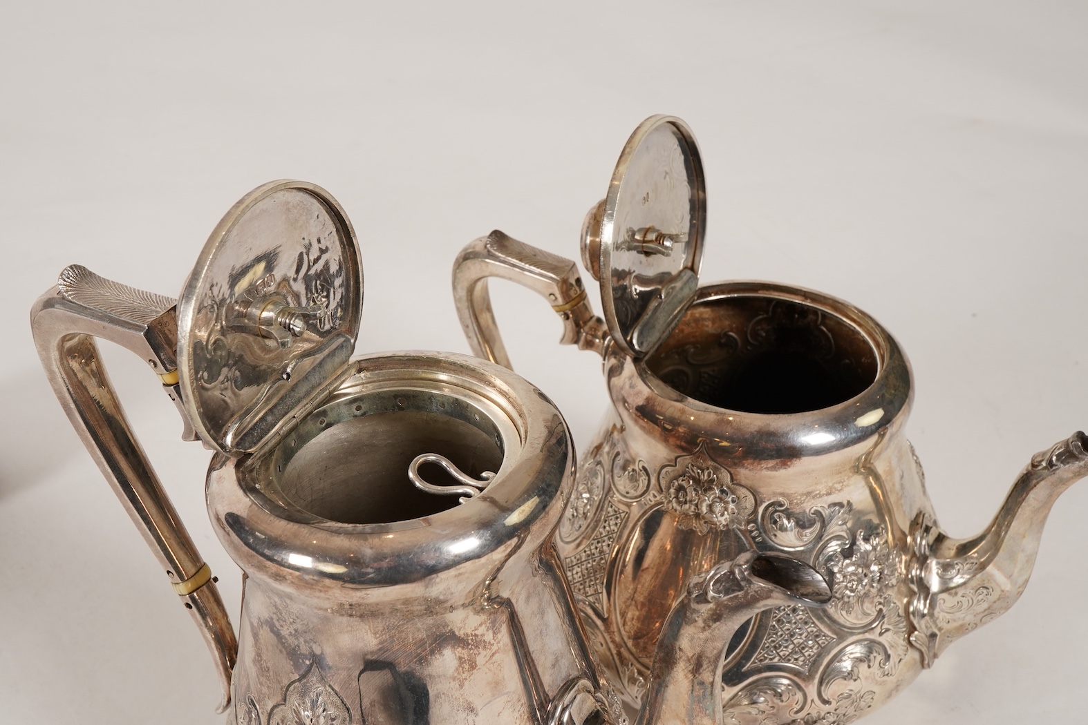 A Victorian embossed silver four piece tea and coffee service by Daniel & Charles Houle